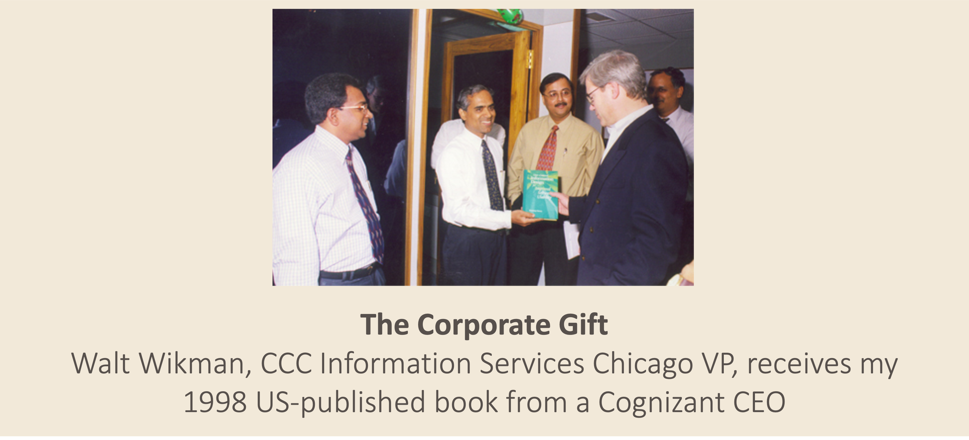The Corporate Gift: Walt Wikman, CCC Information Services Chicago VP, receives my 1998 US-published book from a Cognizant CEO